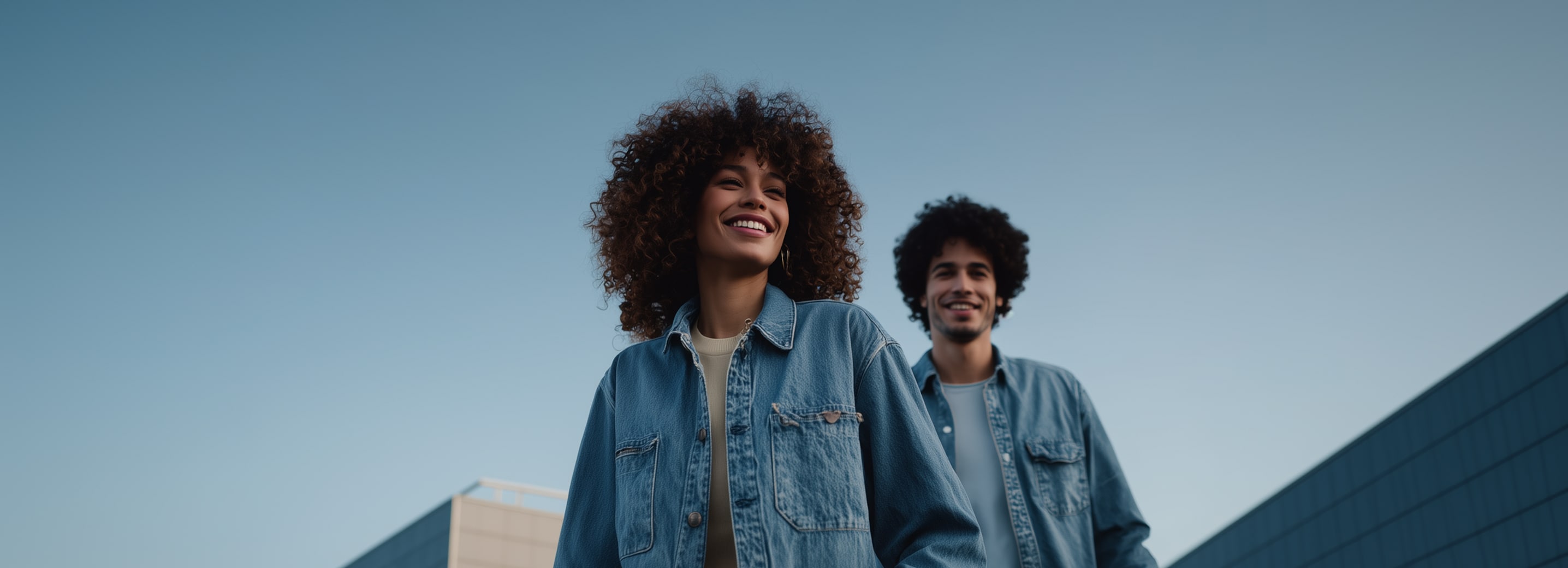 Woman and man walking down the street dressed in neutral colours