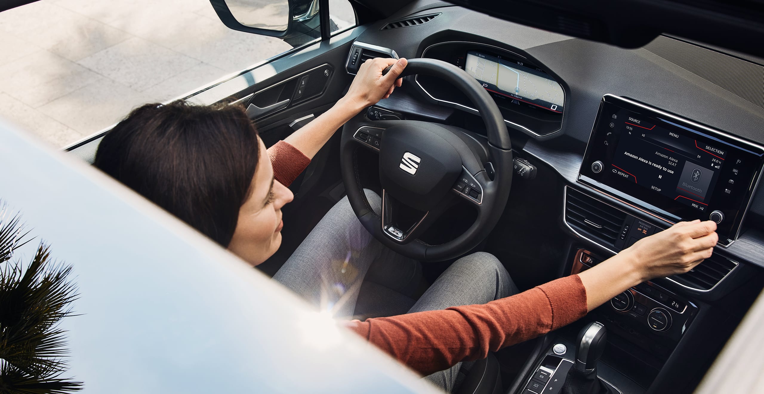 Woman using Amazon Alexa in SEAT car