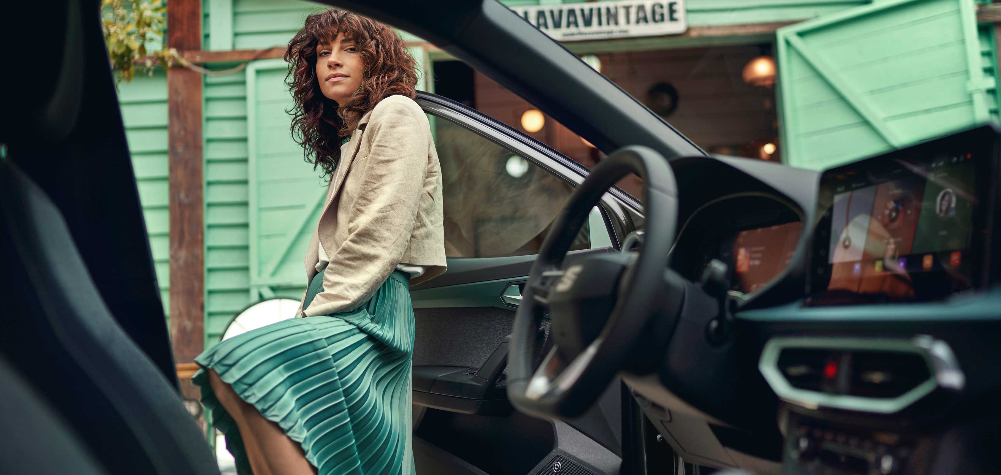 SEAT Arona interior view of a woman entering the vehicle